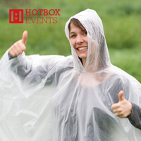 Steph Newman wearing 2012 festival ponchos for volunteers