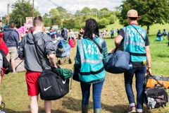 0019 Leeds festival goers arriving with the help of CATs 