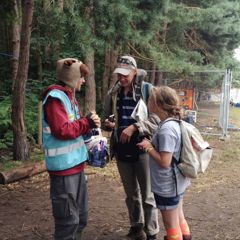 One of our helpful festival volunteers assisting some customers 