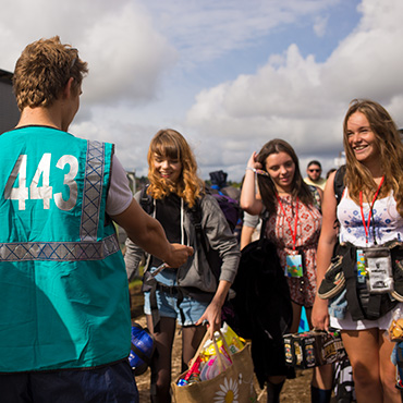 Volunteer at Reading Festival - Campsite volunteers welcoming festival goers