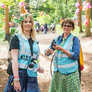 Volunteer at RiZE Festival - Pixie volunteers with flowers