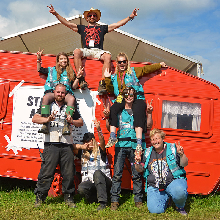 Volunteer at Leeds Festival with Hotbox Events - Campsite volunteers sitting on caravan