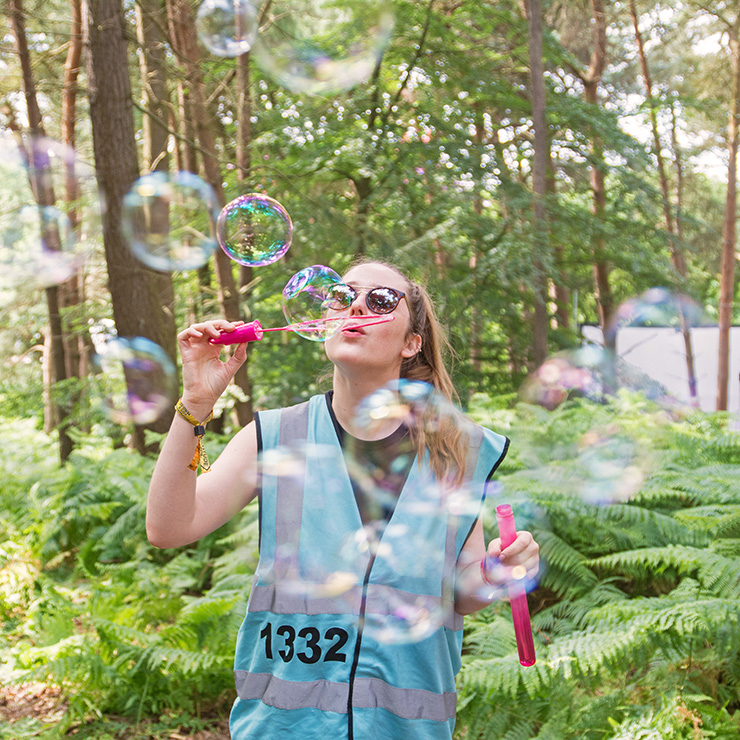 Volunteer at Camp Bestival 2020 with Hotbox Events - Volunteer blowing bubbles
