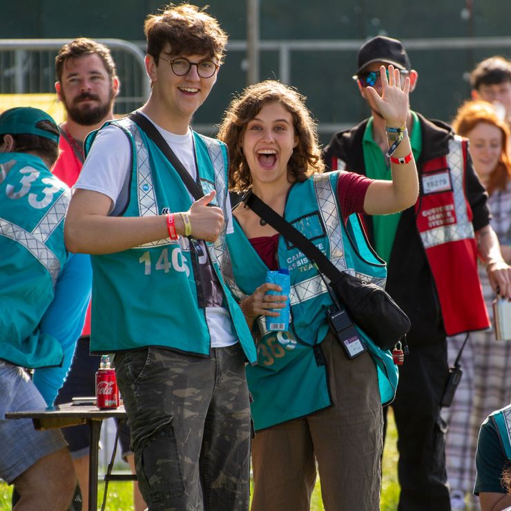 Volunteer at Reading Festival 2020 with Hotbox Events - Volunteers laughing and waving