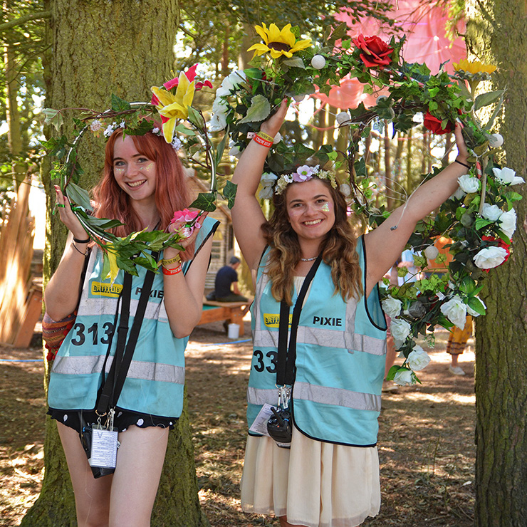 Volunteer at Latitude Festival 2022 with Hotbox Events - Pixie volunteers in the woods with flower garlands - 2022-001 740PxSq72Dpi