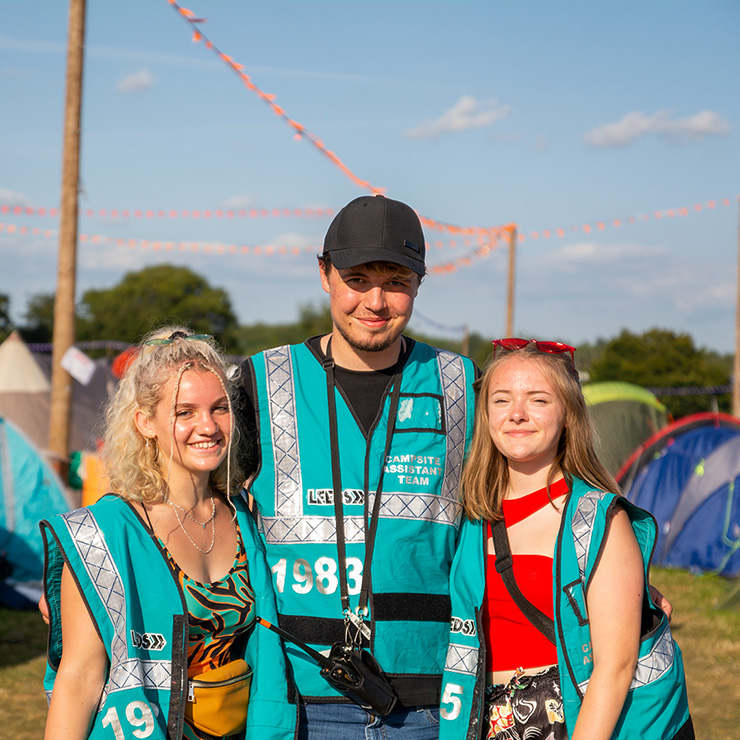 Volunteer at Leeds Festival 2022 with Hotbox Events - Volunteer group smiling in festival campsite 2022-001 740PxSq72Dpi