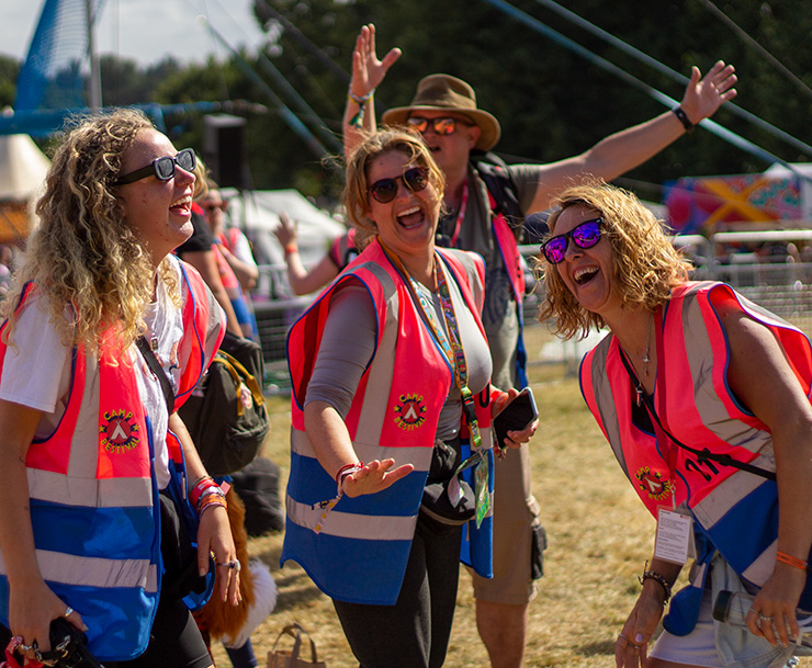 Jobs and Volunteering at Camp Bestival Shropshire with Hotbox Events - Team of arena stewards laughing v2023001 740x609Px72Dpi