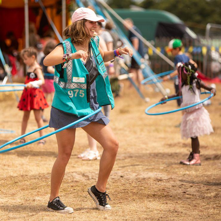 Volunteer at Latitude Festival 2022 with Hotbox Events - Kids area volunteer hula hooping - 2022-001 740PxSq72Dpi