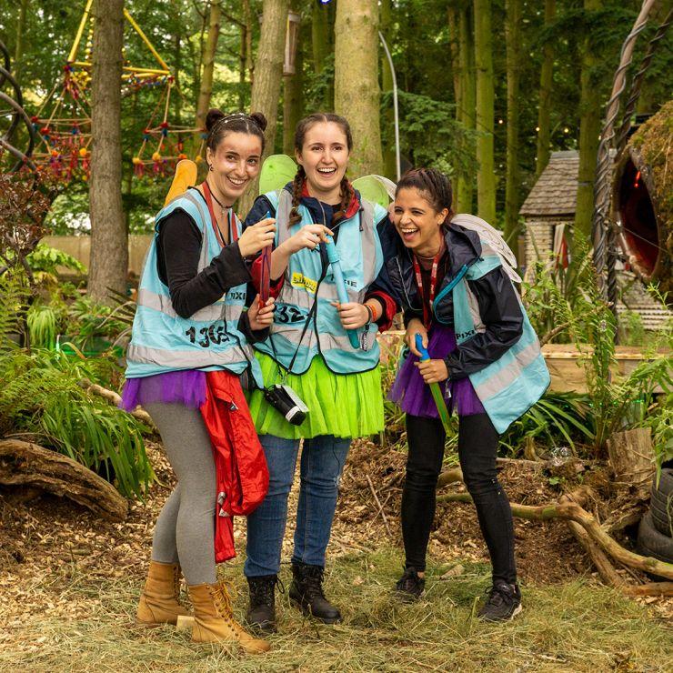 Volunteer at Latitude Festival 2022 with Hotbox Events - Pixie volunteers laughing in the woods - 2022-001 740PxSq72Dpi
