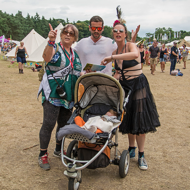 Jobs and Volunteering at Camp Bestival Dorset 2022 with Hotbox Events - Arena volunteer helping festival goers - 2022-001 740PxSq72Dpi