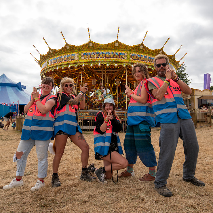 Jobs and Volunteering at Camp Bestival Dorset with Hotbox Events - Arena stewards in front of carousel v2023001 740PxSq72Dpi
